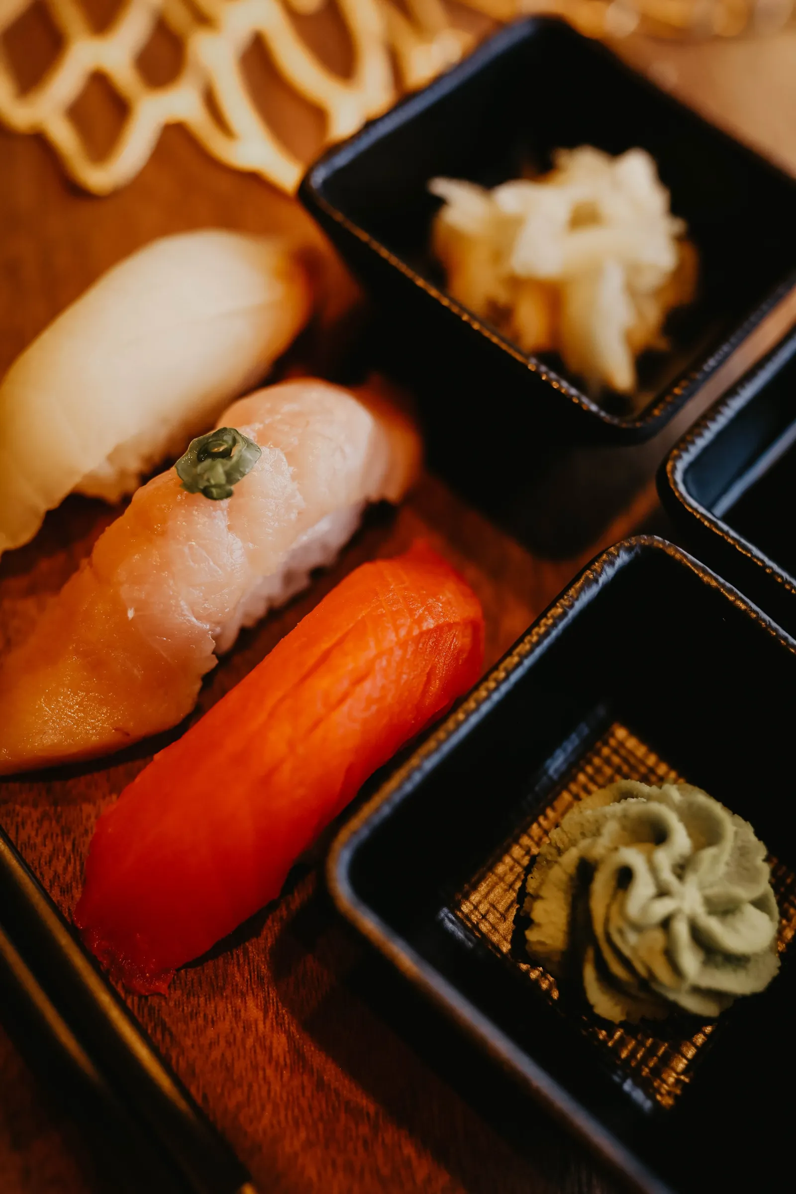 Sushi chef preparing a roll at Sakura Sushi & Grill