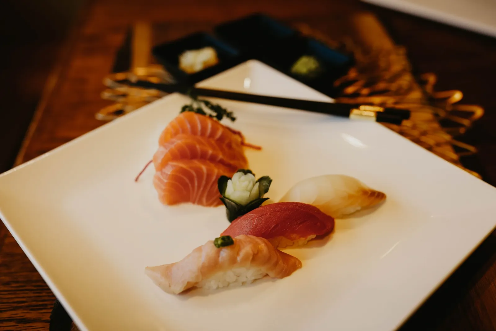 Specialty sushi roll plated with garnish